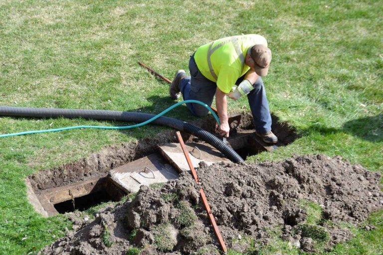 homeguide-contractor-inspecting-septic-tank-and-system
